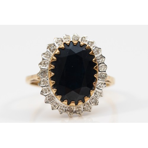 571 - A 9ct gold sapphire and diamond cocktail ring, Q, 4.3g