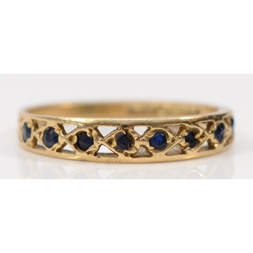 574 - A 9ct gold sapphire half eternity ring, London 1979, M 1/2, 1.3g