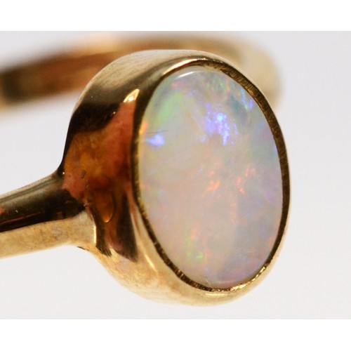 586 - A 9ct gold bezel set opal dress ring, P, 1.9g