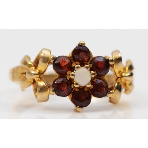 587 - A 9ct gold vintage garnet and opal dress ring with patterned shoulders, Birmingham 1978, M 1/2, 3.4g