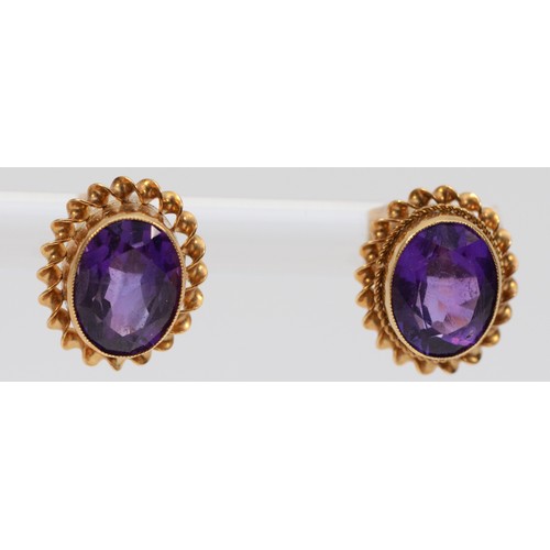 590 - A pair of 9ct gold amethyst stud earrings with scroll backs, 7mm, 2.2g