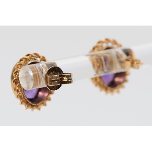 590 - A pair of 9ct gold amethyst stud earrings with scroll backs, 7mm, 2.2g