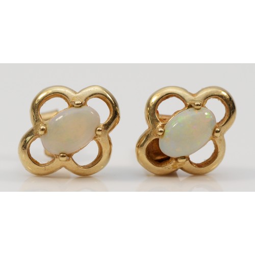 591 - A pair of 9ct gold opal stud earrings with scroll backs, 1.3g