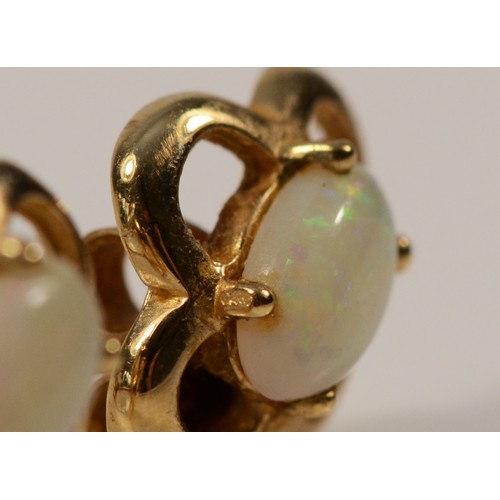 591 - A pair of 9ct gold opal stud earrings with scroll backs, 1.3g