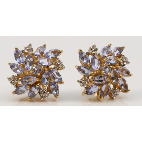 592 - A pair of 9ct gold marquise cut tanzanite and diamond stud earrings with scroll backs, 10mm, 3.4g