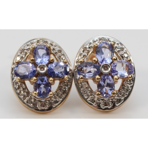 594 - A pair of 9ct gold oval cut tanzanite and diamond stud earrings, 12mm, 2.5g