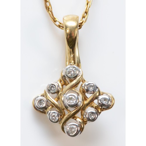 597 - A 9ct gold diamond set pendant with chain, 12mm across, 2.4g