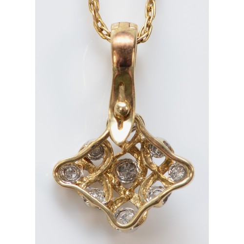 597 - A 9ct gold diamond set pendant with chain, 12mm across, 2.4g