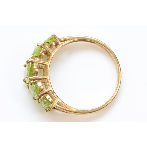 612 - A 9ct gold five stone Peridot dress ring, claw set, R, 2.8g