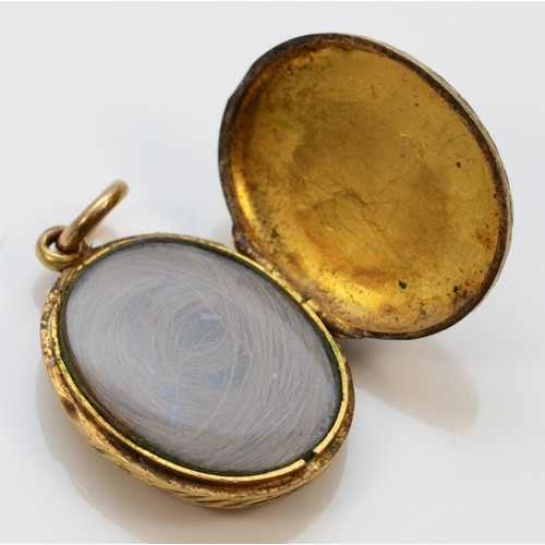 614 - A Victorian gold hair locket pendant with enamel detail, 20mm length, 4.2g