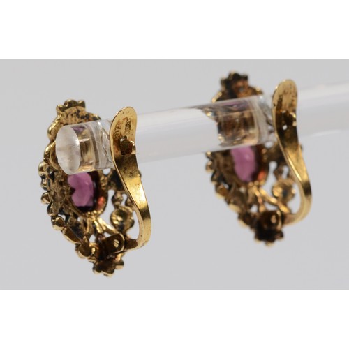 617 - A pair of gold cased garnet earrings, 18mm length, some gold is flaking, 3.5g