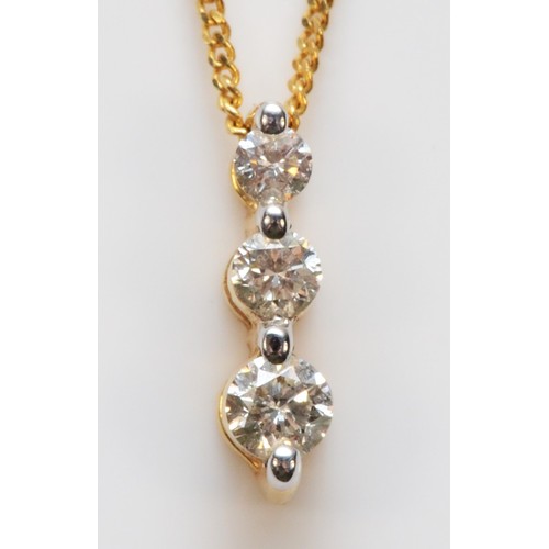 618 - A 9ct gold three diamond graduating pendant with chain, 2.1g