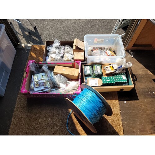 38 - 4 boxes of consumables to include wood screws, nuts and bolts, door handles, shoot bolts and spark p... 