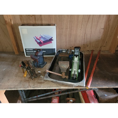 39 - Diamond wheeled tile cutter, hand jack, large stapler, also 2 x Record bench vice.