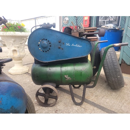 55 - A 20th century Briggs & Stratton petrol driven compressor, together with six vehicle wheels, a pair ... 