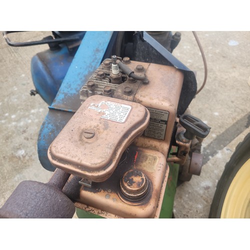 55 - A 20th century Briggs & Stratton petrol driven compressor, together with six vehicle wheels, a pair ... 