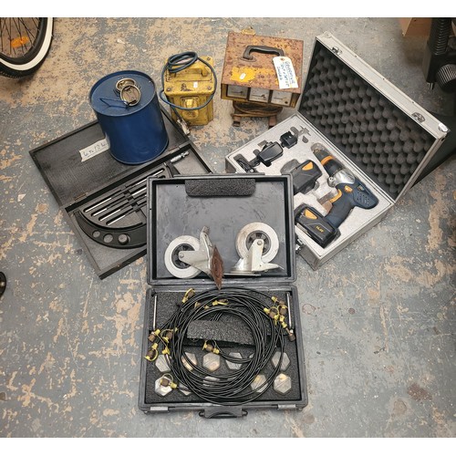 56 - A collection of tools, to include hydraulic pressure testing kit, a cased MAC cordless drill, AC pow... 