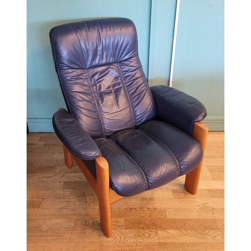 A Ekornes Stressless Montana recliner armchair, highback, teak frame with blue cori leather upholstery, W85, H96, D71cm.