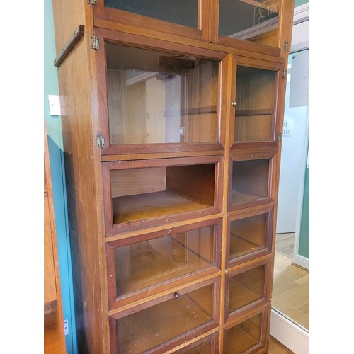 366 - An early 20th century mahogany haberdashery shop display cabinet, having an arrangement of thirteen ... 