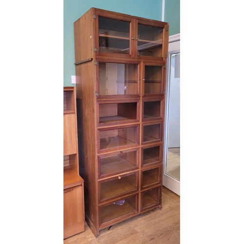 366 - An early 20th century mahogany haberdashery shop display cabinet, having an arrangement of thirteen ... 