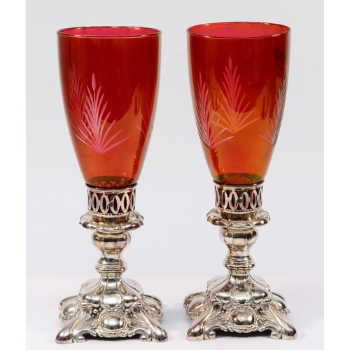 2 - A pair of Canadian electroplated and ruby glass candlesticks, 28cm