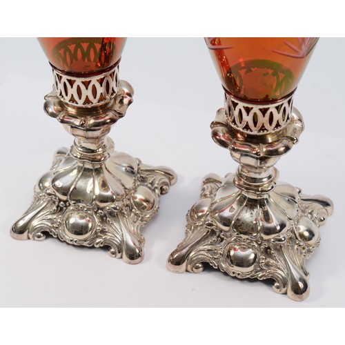 2 - A pair of Canadian electroplated and ruby glass candlesticks, 28cm