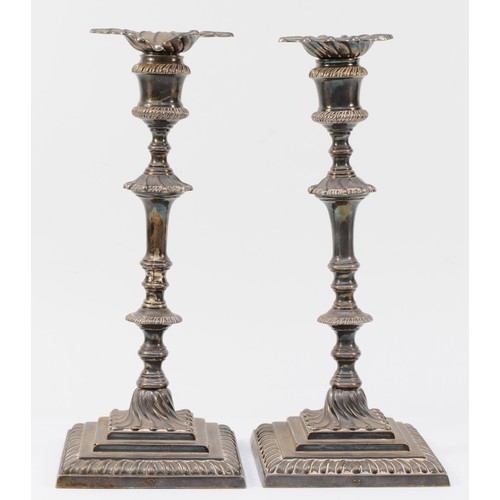 6 - A Victorian silver pair of George III style candlesticks, by Dixon & Sons, Sheffield 1896, detachabl... 