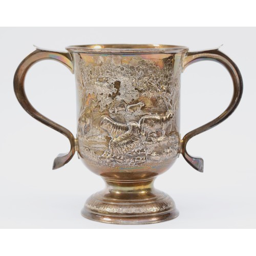 7 - A George III silver two handled cup, by John Munns, London 1765, later embossed with sheep in a wood... 