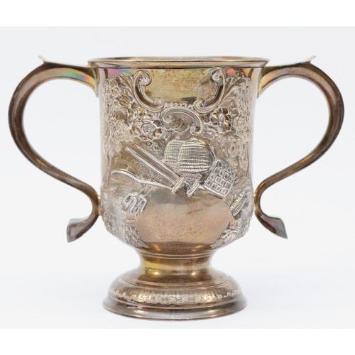 7 - A George III silver two handled cup, by John Munns, London 1765, later embossed with sheep in a wood... 