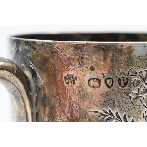 14 - A Victorian silver christening mug, London 1890, with engraved fern decoration, vacant and unused ca... 