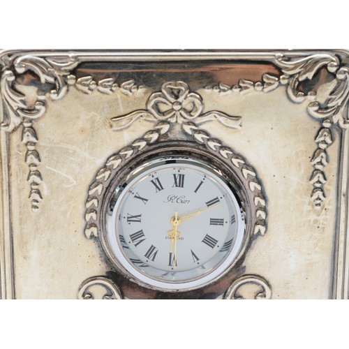 15 - A silver combination photograph frame and quartz clock, by Carr, Sheffield 1997, wooden back, 18 x11... 