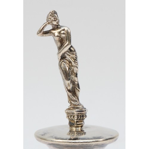 16 - A silver bottle stopper, Sheffield 1998, depicting a scantily clad lady, overall height 13.5cm