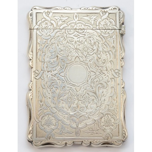 20 - A Victorian silver visiting card case, Birmingham 1899, with all over scroll engraved decoration, 10... 