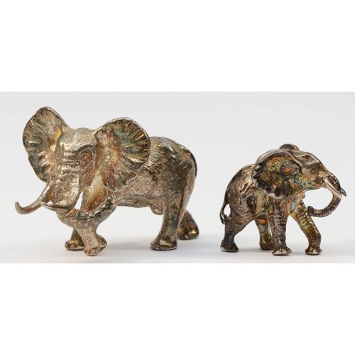 24 - Attributed to Patrick Mavros, Zimbabwe, a cast silver African elephant, poorly marked, also with tri... 