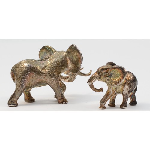 24 - Attributed to Patrick Mavros, Zimbabwe, a cast silver African elephant, poorly marked, also with tri... 