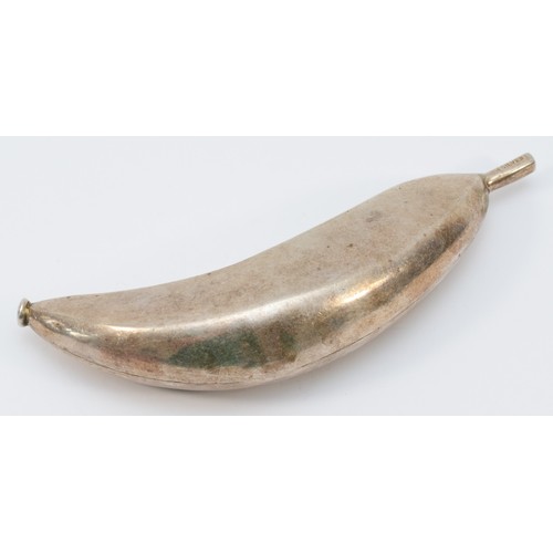 37 - A Zambian silver banana, from the Kabwe region, stamped CM SILVER, 19cm, 202gm, 13.5cm diameter.