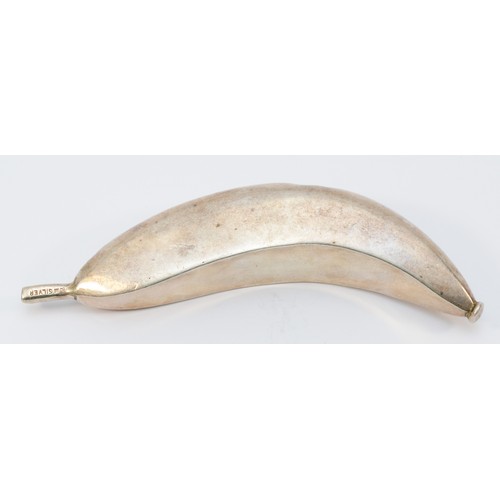 37 - A Zambian silver banana, from the Kabwe region, stamped CM SILVER, 19cm, 202gm, 13.5cm diameter.