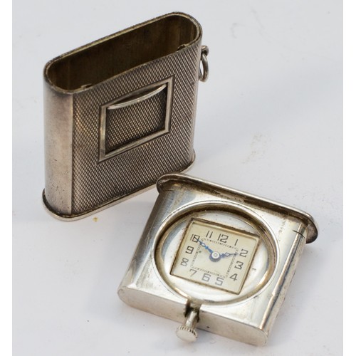 56 - An Art Deco 900 standard silver purse watch, stamped 900, with slide cover revealing the dial, 34 x ... 