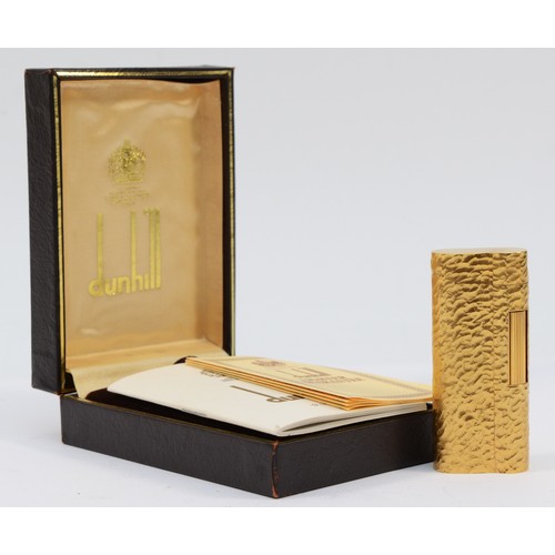 57 - Dunhill, a gold plated bark finish rollagas S lighter, serial number D61241, apparently unused, with... 