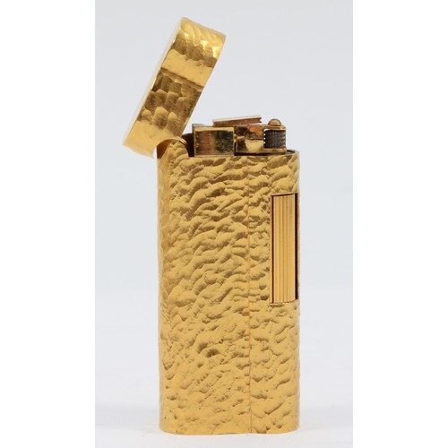 57 - Dunhill, a gold plated bark finish rollagas S lighter, serial number D61241, apparently unused, with... 