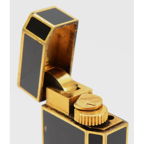 60 - Must de Cartier, a gold plated and black enamel rollagas lighter, serial number 53887X, 58mm