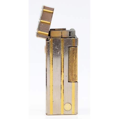 63 - Dunhill, a stainless steel and gold plated rollagas lighter, no serial number, case