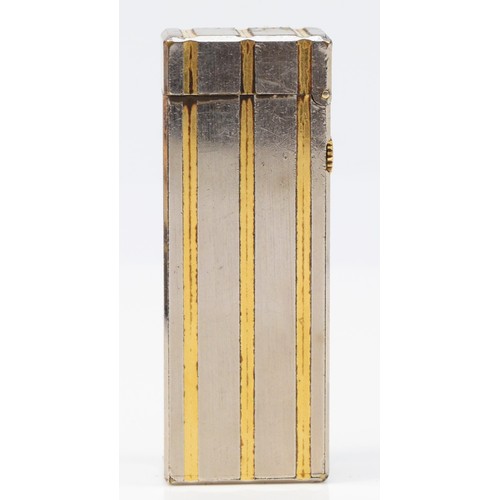 63 - Dunhill, a stainless steel and gold plated rollagas lighter, no serial number, case