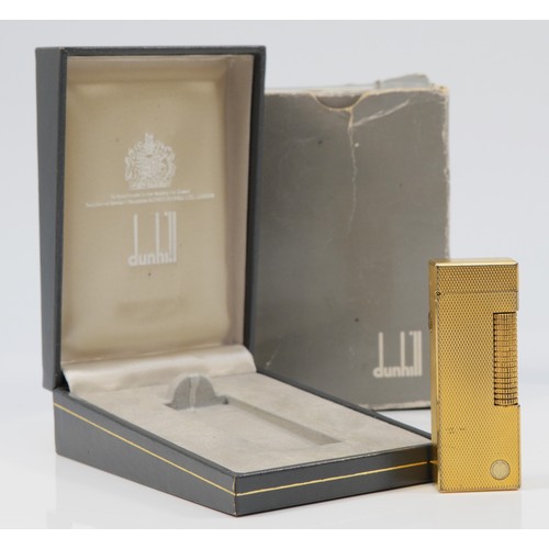 64 - Dunhill, a gold plated rollagas lighter, no serial number, case and box.