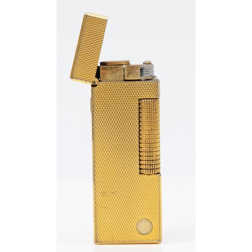 64 - Dunhill, a gold plated rollagas lighter, no serial number, case and box.