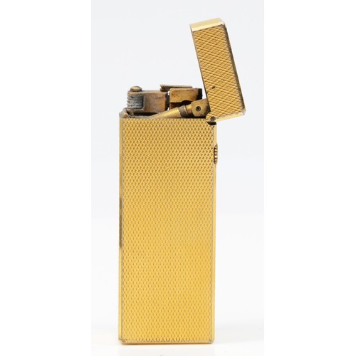 64 - Dunhill, a gold plated rollagas lighter, no serial number, case and box.