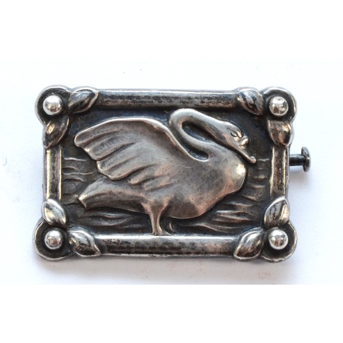 71 - Georg Jensen, a silver swan brooch, with floral border, stamped with 1933-44 hallmarks, GJ 925, Ster... 