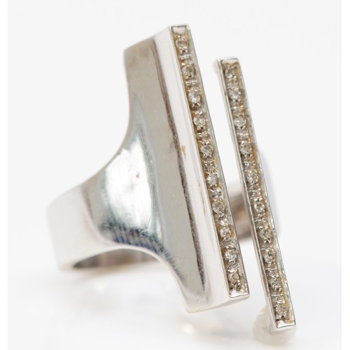 74 - A white gold diamond ring, two rows of single cut diamonds to a modernist style cuff ring, front mea... 