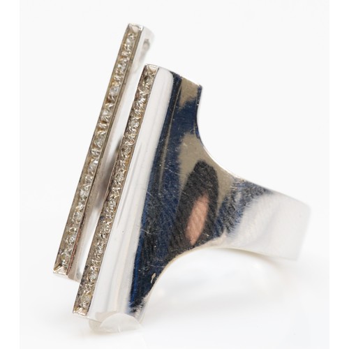 74 - A white gold diamond ring, two rows of single cut diamonds to a modernist style cuff ring, front mea... 