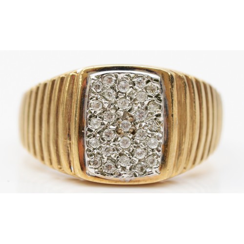 76 - A 9ct gold brilliant cut diamond faced signet ring, stepped detailing to the shoulders, London 1985 ... 